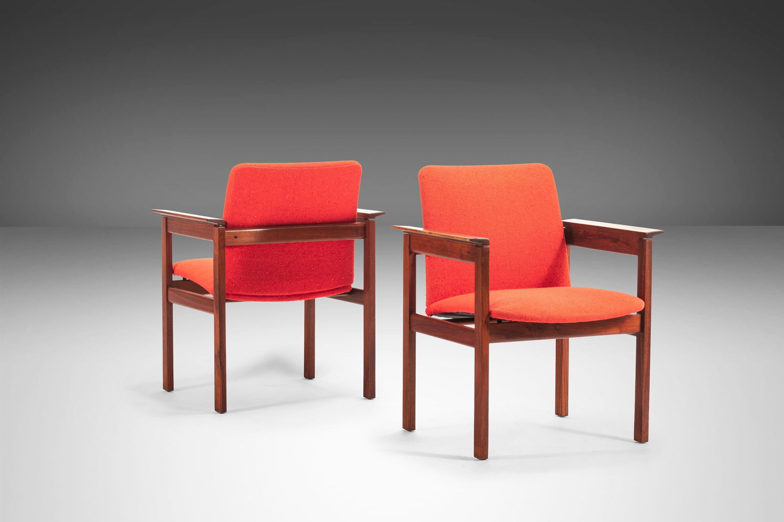 Pair of Jens Risom Mid-Century Chairs in Red Upholstery Walnut Frame 1960s USA: Pair of Jens Risom Mid-Century Chairs in Red Upholstery Walnut Frame 1960s USA This exquisite set of two Jens Risom accent chairs showcases a striking mid-century modern design, featuring original red