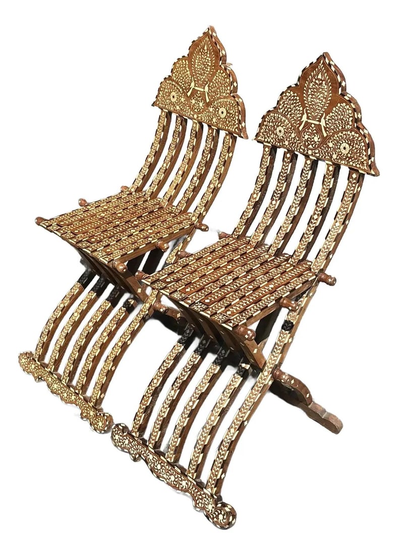 Exquisite Vintage Boho Moorish Inlay Folding Chairs Pair: Exquisite Vintage Boho Moorish Inlay Folding Chairs Pair Discover the exotic charm of this exquisite pair of Vintage Boho Moorish Inlay Folding Chairs. Each chair showcases extraordinary