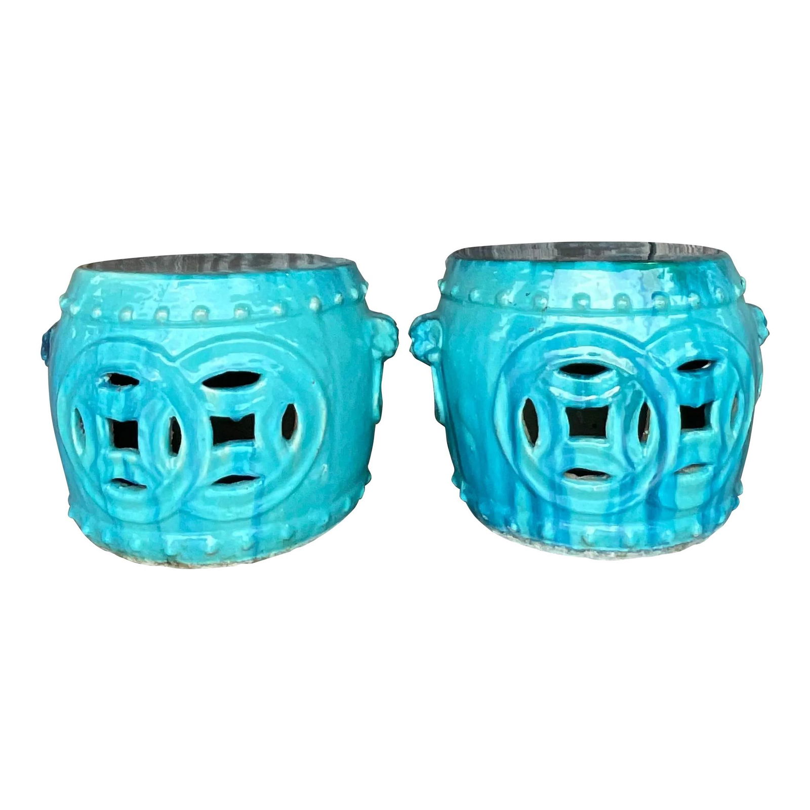 Chic Vintage Teal Ceramic Low Stools Pair with Medallion Design: Chic Vintage Teal Ceramic Low Stools Pair with Medallion Design Introducing a fabulous pair of vintage low stools, featuring a chic glazed ceramic finish in a striking teal color. The stools showcase