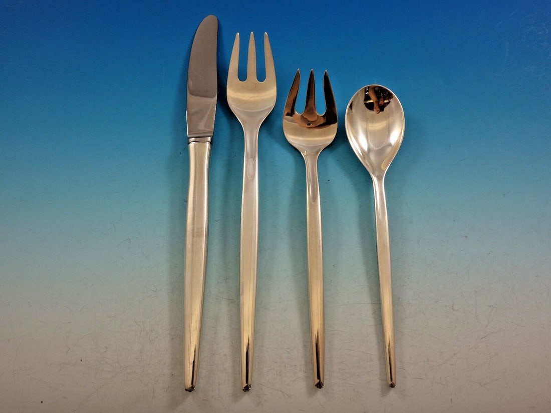 Michelsen Tulip Sterling Silver 4-Piece Dinner Place Setting: Michelsen Tulip Sterling Silver 4-Piece Dinner Place Setting Elevate your dining experience with this exquisite 4-piece dinner size place setting from the renowned Michelsen brand, featuring the elega