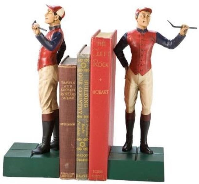 Charming Lodge Style Hand-Cast Jockey Boy Bookends in Resin: Charming Lodge Style Hand-Cast Jockey Boy Bookends in Resin Enhance your home decor with these charming Hand-Cast Jockey Boy Bookends, designed in a classic lodge style. Each bookend showcases a highl