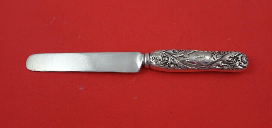 Tiffany & Co Chrysanthemum Sterling Silver Tea Knife 7 Inches: Tiffany & Co Chrysanthemum Sterling Silver Tea Knife 7 Inches This exquisite tea knife, crafted by Tiffany & Co., showcases the elegant Chrysanthemum pattern. Made from high-quality sterling silver, t