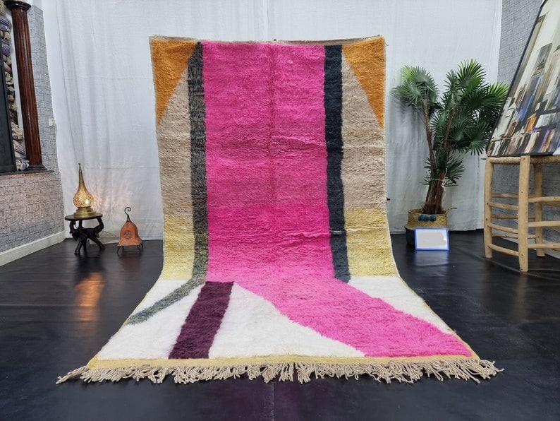 Authentic Handwoven Moroccan Berber Pink Wool Area Rug 9.84 x 6.56 Feet: Authentic Handwoven Moroccan Berber Pink Wool Area Rug 9.84 x 6.56 Feet Enhance your living space with this stunning handwoven Moroccan Berber wool area rug. Featuring a vibrant assortment of colors i