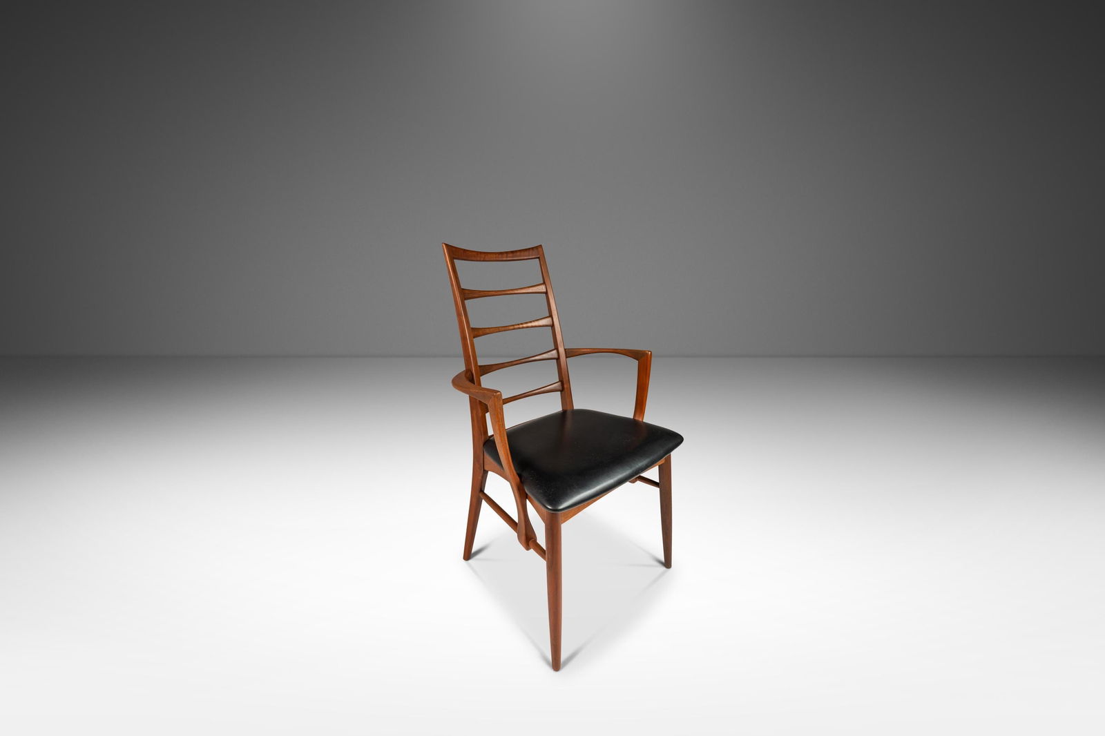 Danish Modern Lis Chair by Niels Koefoed in Walnut & Vinyl 1960s: Danish Modern Lis Chair by Niels Koefoed in Walnut & Vinyl 1960s Presenting a stunning Danish Modern Captain's Arm "Lis" Chair crafted from solid walnut and featuring original vinyl upholstery, design