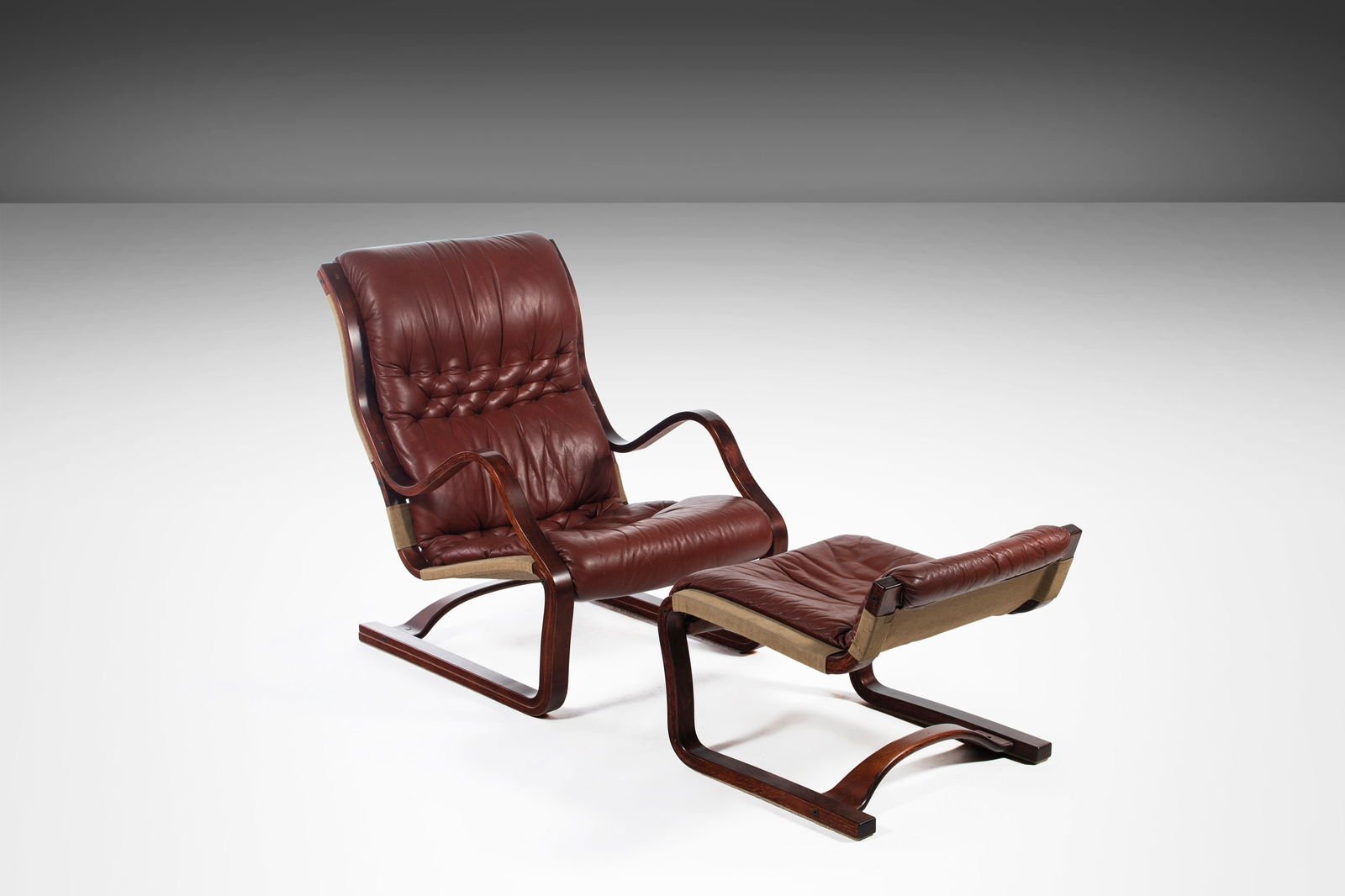 Esko Pajamies Koivutaru Bentwood Chair Ottoman Afromosia Oxblood Leather 1970s: Esko Pajamies Koivutaru Bentwood Chair Ottoman Afromosia Oxblood Leather 1970s Introducing the stunning 'Koivutaru' Bentwood Chair and Matching Ottoman, designed by the renowned Finnish designer Esko