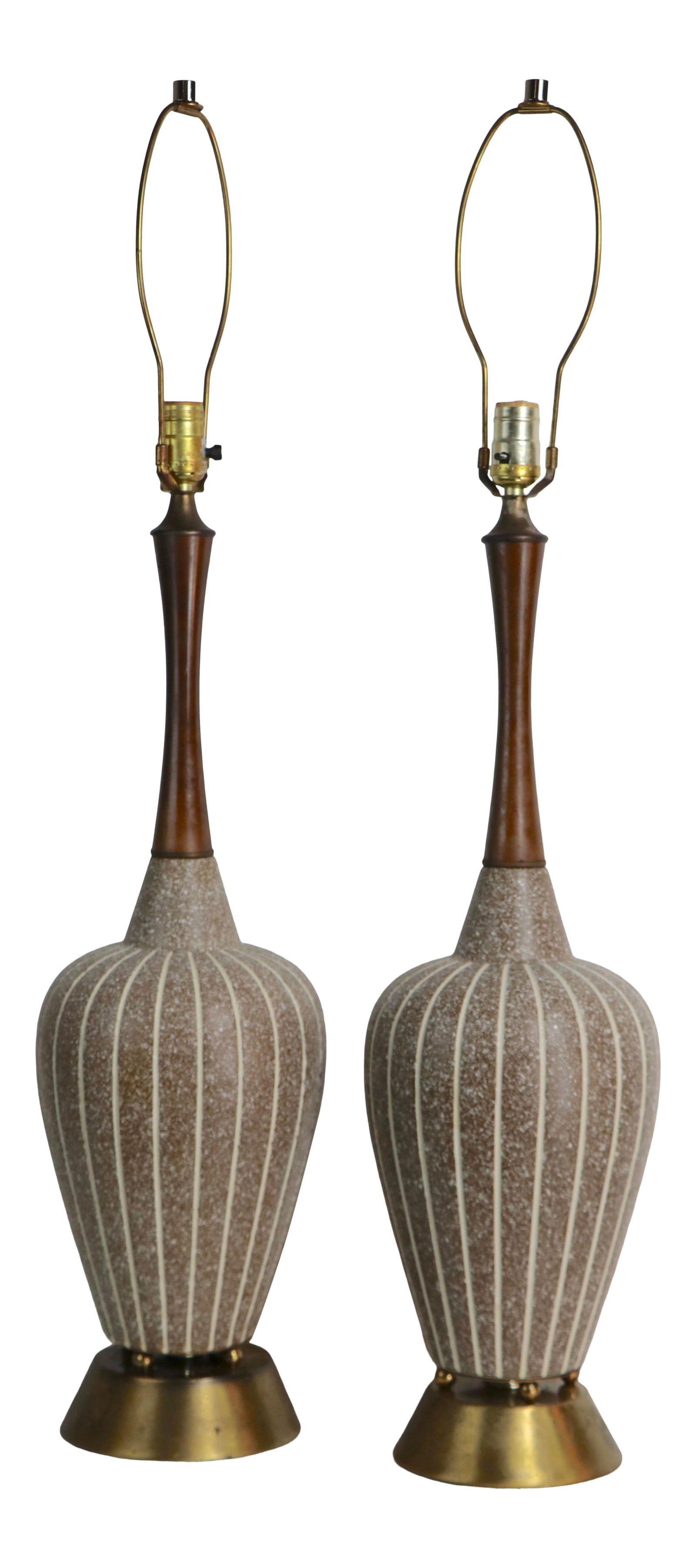 Stylish Mid Century Ceramic Table Lamps with Teak and Brass: Stylish Mid Century Ceramic Table Lamps with Teak and Brass This stylish pair of Mid Century ceramic table lamps showcases a unique striped body design complemented by elegant teak necks and sturdy br