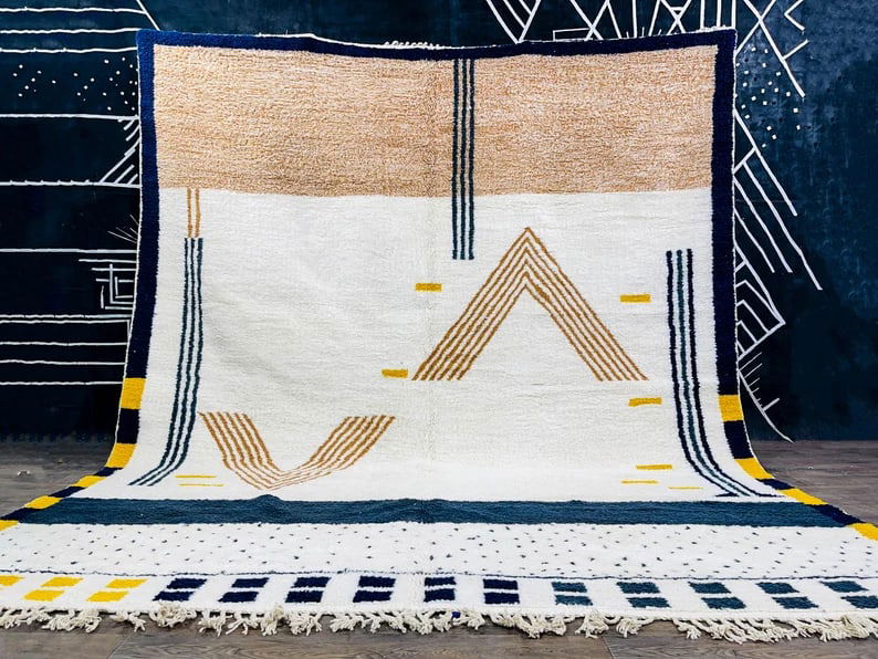 Luxury Handmade Wool Rug 9.84 x 6.56 feet Moroccan Craftsmanship: Luxury Handmade Wool Rug 9.84 x 6.56 feet Moroccan Craftsmanship Experience the warmth and luxury of this soft, handmade wool rug, skillfully crafted by local Berber women weavers in the Atlas Mountai