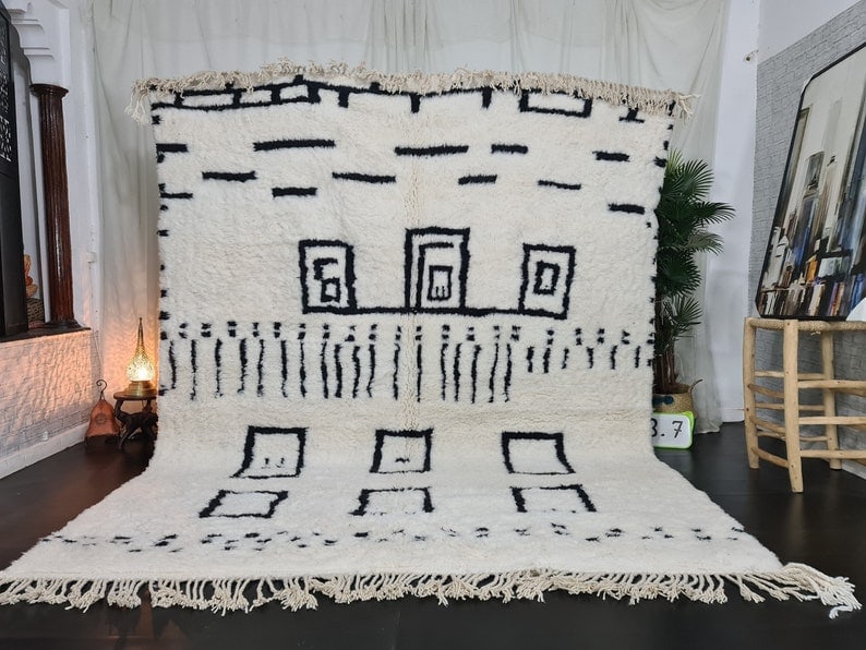 Authentic Handmade Moroccan Berber Wool Rug 9.84 x 6.56 Feet: Authentic Handmade Moroccan Berber Wool Rug 9.84 x 6.56 Feet Enhance your living space with this stunning soft white handmade Moroccan Berber wool rug. Crafted by skilled local Berber women weavers in