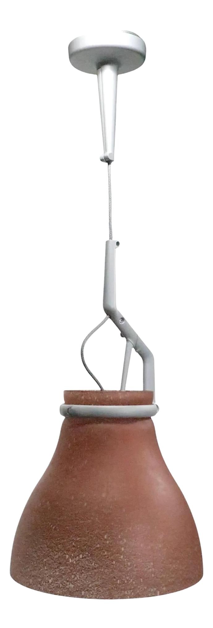 Chic 1970s Luceplan Modernist Pendant Light Italian Design: Chic 1970s Luceplan Modernist Pendant Light Italian Design This stunning modernist pendant light from Luceplan, crafted in Italy during the 1970s, showcases a chic and stylish design. The fixture boas