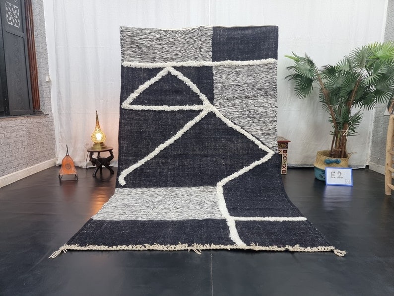 Authentic Moroccan Berber Wool Rug Black Grey 9.84 x 6.56 Feet: Authentic Moroccan Berber Wool Rug Black Grey 9.84 x 6.56 Feet Discover the beauty of this authentic Black and Grey Handmade Moroccan Berber Wool Area Rug. Skillfully handwoven in the Atlas Mountains