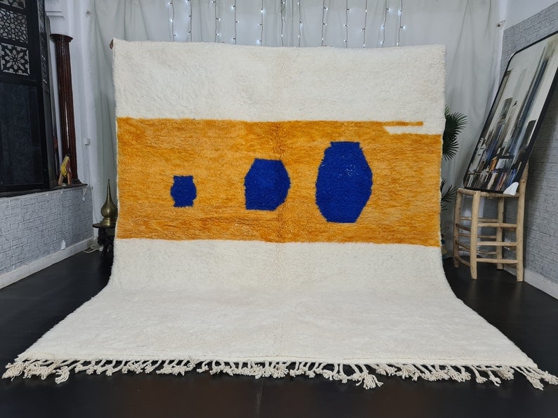 Handmade Moroccan Berber Wool Area Rug 9.84 x 6.56 Feet: Handmade Moroccan Berber Wool Area Rug 9.84 x 6.56 Feet Enhance your living space with this stunning Artistic White Soft Handmade Moroccan Berber Wool Area Rug. Crafted by local Berber women weavers i
