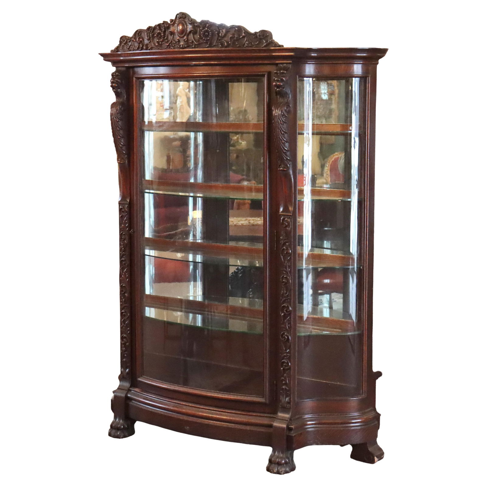 Antique Oak China Cabinet with Griffin and Foliate Carving Attributed to RJ Horner: Antique Oak China Cabinet with Griffin and Foliate Carving Attributed to RJ Horner This stunning oversized antique china cabinet, attributed to RJ Horner, showcases exquisite figural griffins and intr