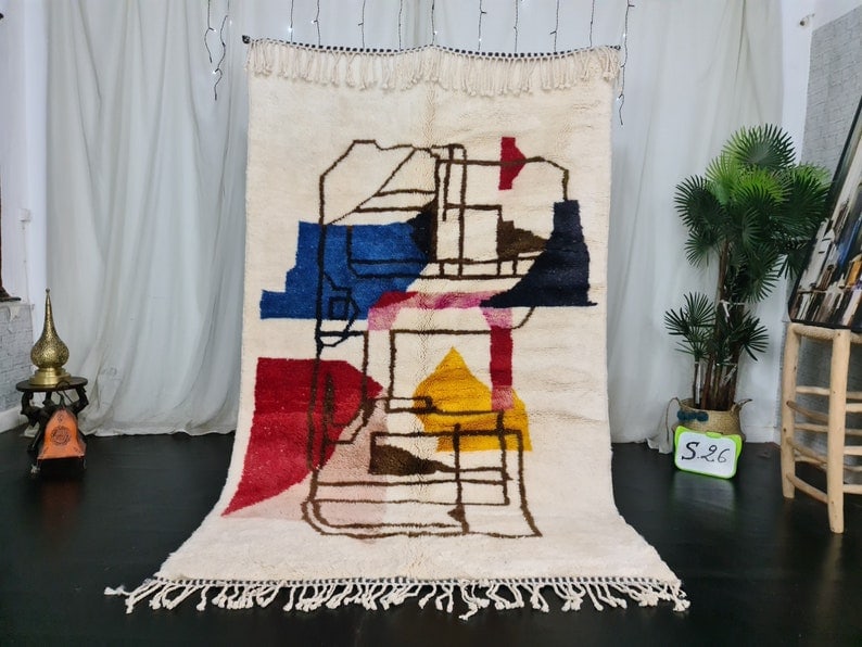 Authentic Handmade Moroccan Berber Wool Rug 10 x 5 Feet: Authentic Handmade Moroccan Berber Wool Rug 10 x 5 Feet This Authentic Colorful Handmade Moroccan Berber Wool Rug is a stunning piece crafted by local Berber women weavers in the Middle Atlas Mountain