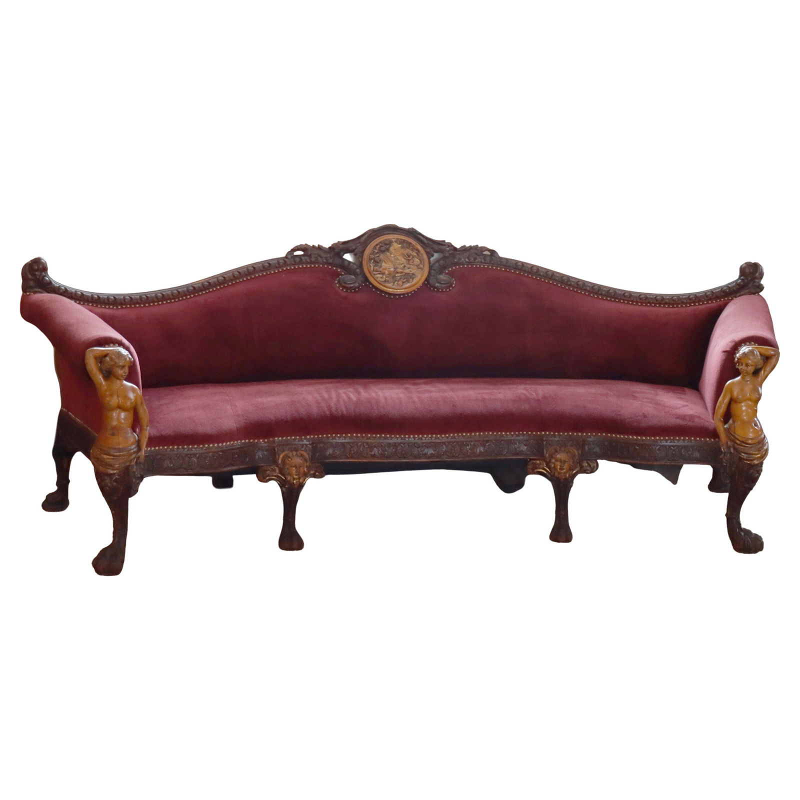 19th Century Baroque Italian Walnut Sofa with Nymph and Cherub Carvings: 19th Century Baroque Italian Walnut Sofa with Nymph and Cherub Carvings This antique Italian Baroque curved sofa from the 19th century showcases exquisite craftsmanship in carved walnut and fruitwood.