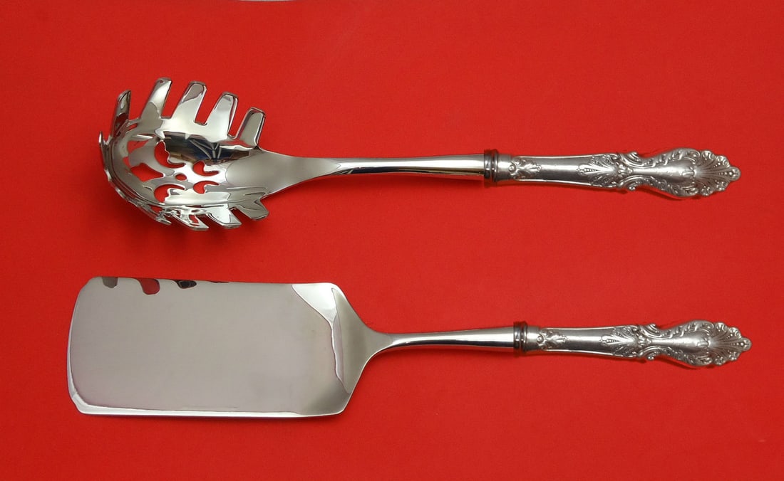 Rogers & Hamilton Raphael 2-Piece Silverplate Italian Serving Set: Rogers & Hamilton Raphael 2-Piece Silverplate Italian Serving Set This exquisite 2-piece Italian set, part of the Raphael collection by Rogers & Hamilton, is crafted from high-quality silverplate. It