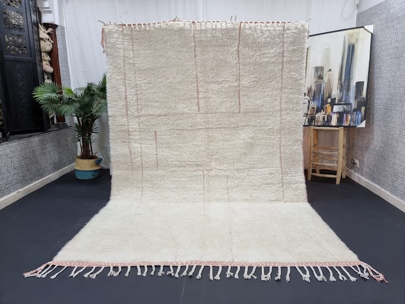 Authentic Handwoven White Pink Engraved Rug from Morocco: Authentic Handwoven White Pink Engraved Rug from Morocco Experience the charm of this authentic soft white and pink rug, beautifully handwoven in the Atlas Mountains by skilled local Berber women. Fea