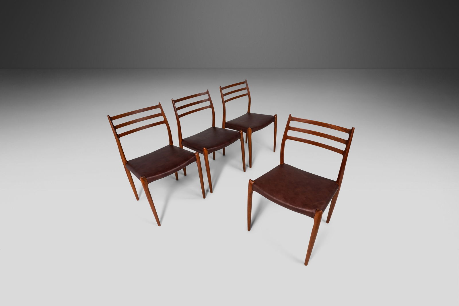 Set of 4 J.L. Moller Model 78 Teak Dining Chairs Leather Denmark 1960s: Set of 4 J.L. Moller Model 78 Teak Dining Chairs Leather Denmark 1960s This set of four Moller Model 78 dining chairs, designed by Niels Otto Moller in 1962, embodies the essence of Danish Modern desi