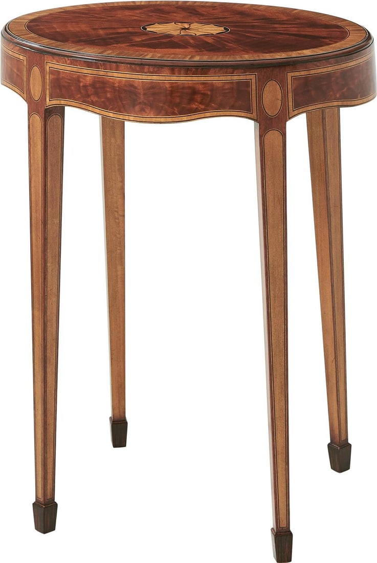 Theodore Alexander Mahogany Oval Accent Table with Fan Inlay: Theodore Alexander Mahogany Oval Accent Table with Fan Inlay Introducing the Mahogany Oval Mompesson Accent Table, a beautifully crafted piece that adds a touch of elegance to any room. This accent ta