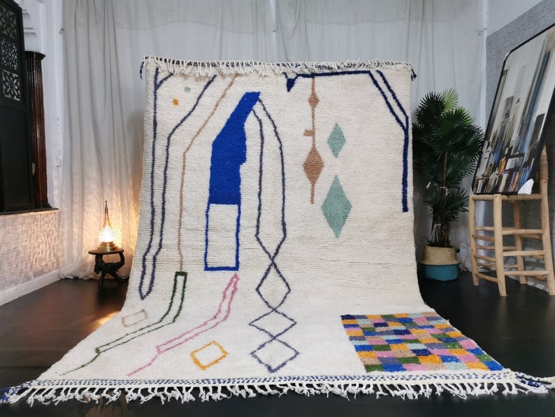 Authentic Handwoven Moroccan Berber Wool Rug 9.84 x 6.56 Feet: Authentic Handwoven Moroccan Berber Wool Rug 9.84 x 6.56 Feet Discover the exquisite craftsmanship of this Elegant Handwoven Moroccan Berber Wool Rug. Meticulously crafted by local Berber women weaver