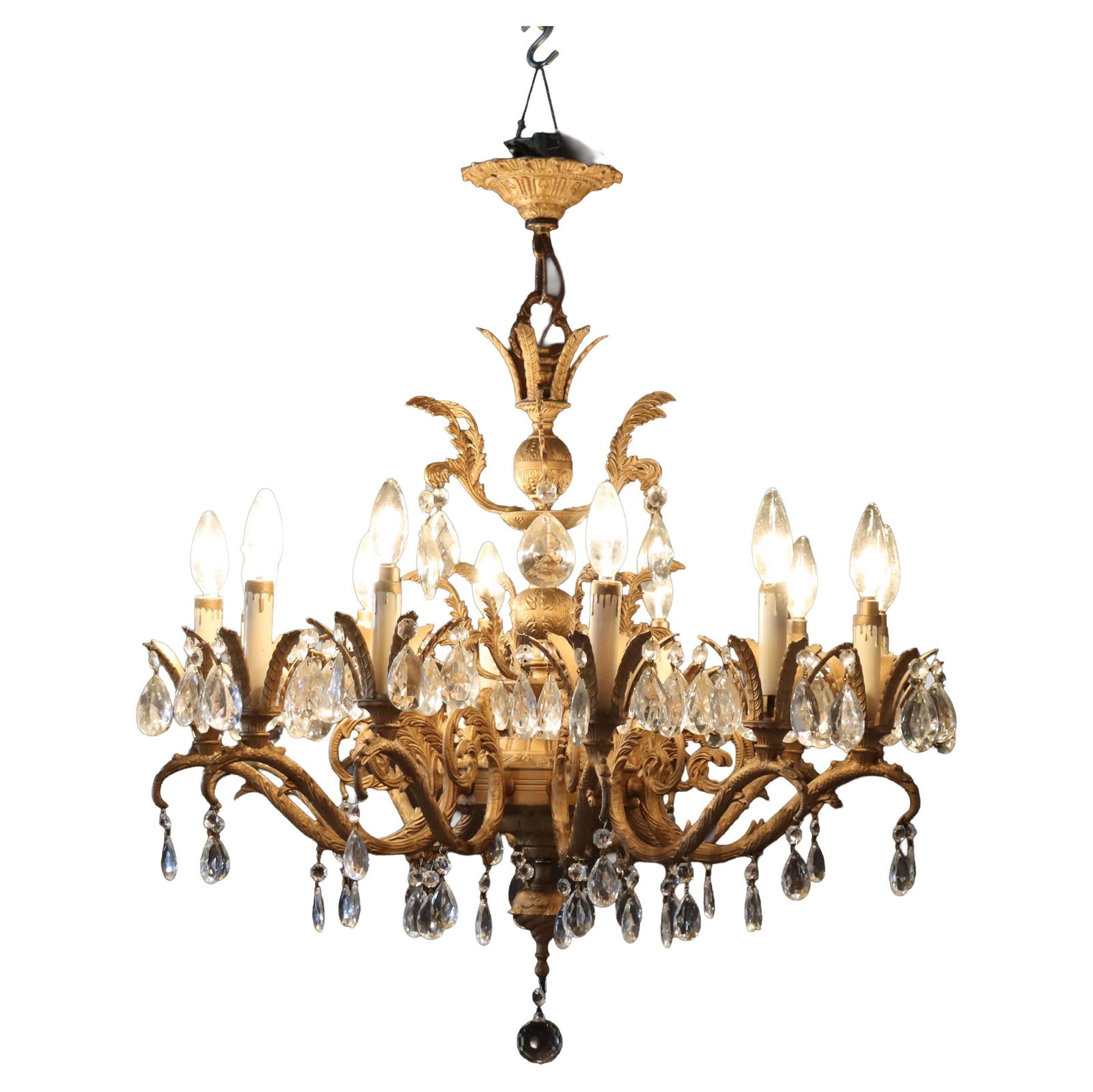 Early 20th Century French Louis XIV Bronze and Crystal 12 Arm Chandelier: Early 20th Century French Louis XIV Bronze and Crystal 12 Arm Chandelier This antique chandelier, crafted in the French Louis XIV style circa 1930, features a beautifully detailed bronze frame with