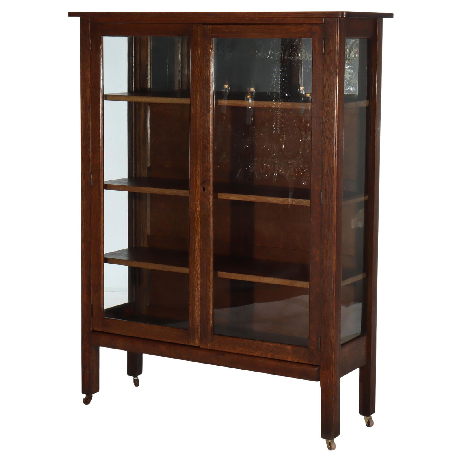 Arts and Crafts Mission Oak China Cabinet in Stickley School Style circa 1910: Arts and Crafts Mission Oak China Cabinet in Stickley School Style circa 1910 This antique Arts and Crafts era china cabinet, crafted circa 1910 in the manner of Stickley, features sturdy oak construc