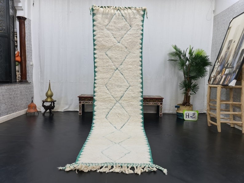 Authentic Moroccan Berber Runner Rug 2 x 10 Feet Soft White Wool: Authentic Moroccan Berber Runner Rug 2 x 10 Feet Soft White Wool Introducing a stunning soft white handmade Moroccan Berber runner rug, featuring an intricately engraved geometric pattern. This beauti