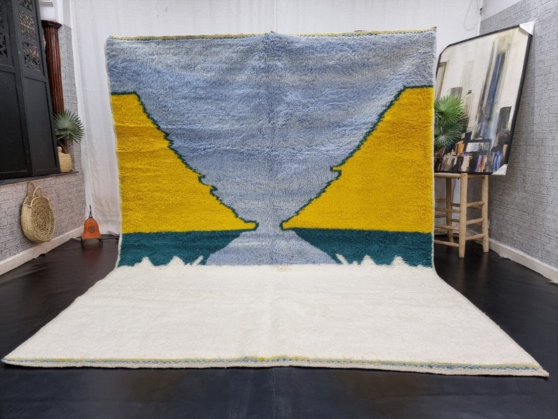 Handmade Moroccan Berber Wool Area Rug 9.84 x 6.56 Feet: Handmade Moroccan Berber Wool Area Rug 9.84 x 6.56 Feet Elevate your space with this Luxury Authentic Soft Colorful Handmade Moroccan Berber Wool Area Rug. Crafted by skilled local Berber women weaver