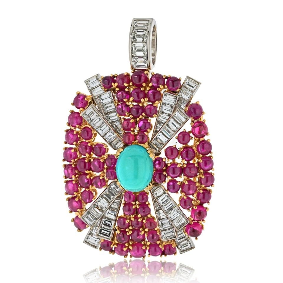 David Webb Platinum 18K Yellow Gold Turquoise Ruby Diamond Pendant: David Webb Platinum 18K Yellow Gold Turquoise Ruby Diamond Pendant This stunning pendant by David Webb showcases a captivating design in platinum and 18K yellow gold. It features a beautiful oval cabo