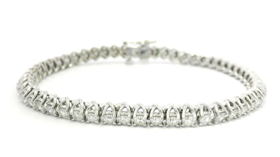 Elegant 14k White Gold 4.86ctw Round Diamond U Shape Tennis Bracelet: Elegant 14k White Gold 4.86ctw Round Diamond U Shape Tennis Bracelet This exquisite tennis bracelet features a classic design crafted from solid 14k white gold. It showcases 54 natural round