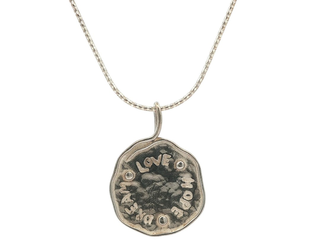Handmade Sterling Silver Love Hope Dream Coin Pendant Necklace: Handmade Sterling Silver Love Hope Dream Coin Pendant Necklace Celebrate love, hope, and dreams with this beautifully handcrafted pendant necklace. Made from high-quality .925 sterling silver, the nec
