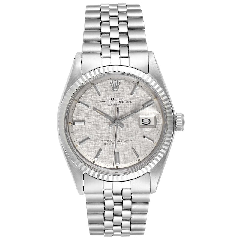 Rolex Datejust Reference 1601/4 Silver Linen Dial Jubilee Bracelet: Rolex Datejust Reference 1601/4 Silver Linen Dial Jubilee Bracelet This Rolex Datejust features a distinctive silver linen dial, complemented by a fluted bezel and mounted on a Jubilee bracelet. The r
