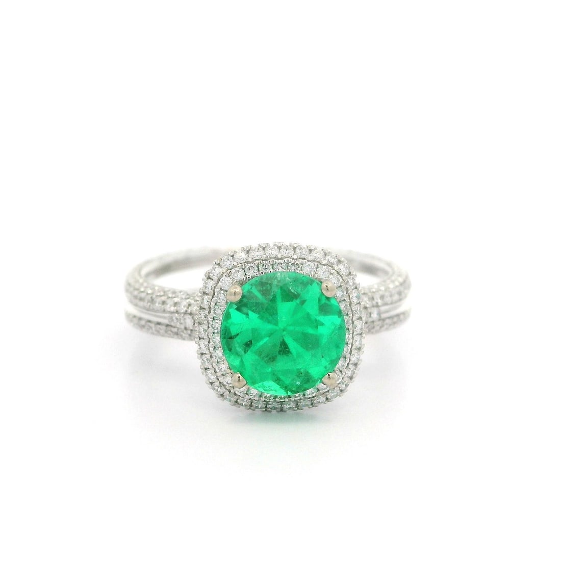 GIA Certified 2.33ctw Colombian Emerald Diamond Ring in White Gold: GIA Certified 2.33ctw Colombian Emerald Diamond Ring in White Gold This exquisite cocktail ring features a stunning natural Colombian emerald, showcased in a round cut and prong set within solid 17-18