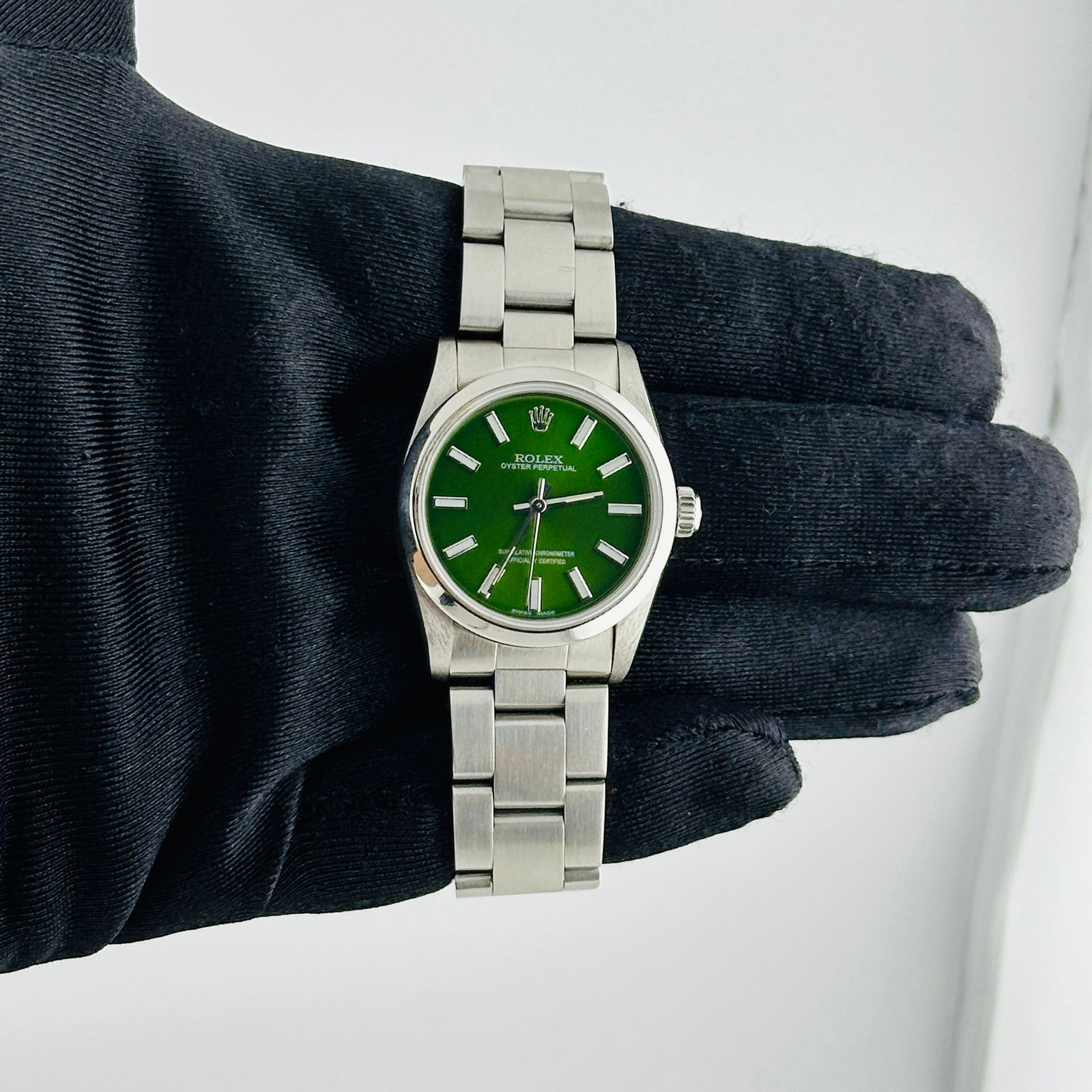 Ladies Oyster Perpetual Ref 67480 Watch With Aftermarket Green Dial: Ladies Oyster Perpetual Ref 67480 Watch With Aftermarket Green Dial This Rolex Oyster Perpetual features an Aftermarket green dial set in a smooth bezel and is paired with a classic Oyster bracelet. D
