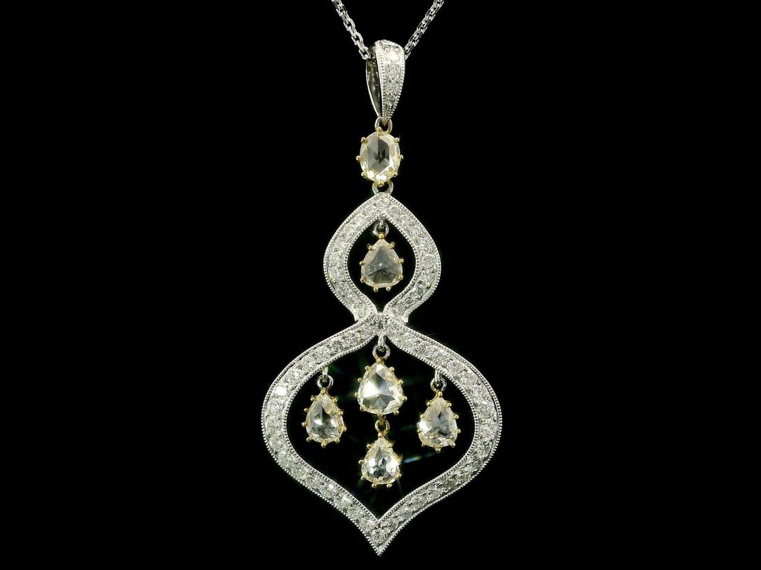 18k Gold Diamond Tassel Pendant Necklace 1.90ctw 18 Inch Chain: 18k Gold Diamond Tassel Pendant Necklace 1.90ctw 18 Inch Chain This stunning necklace features a beautiful tassel pendant crafted from solid 18k yellow and white gold, adorned with a total of 1.90 car