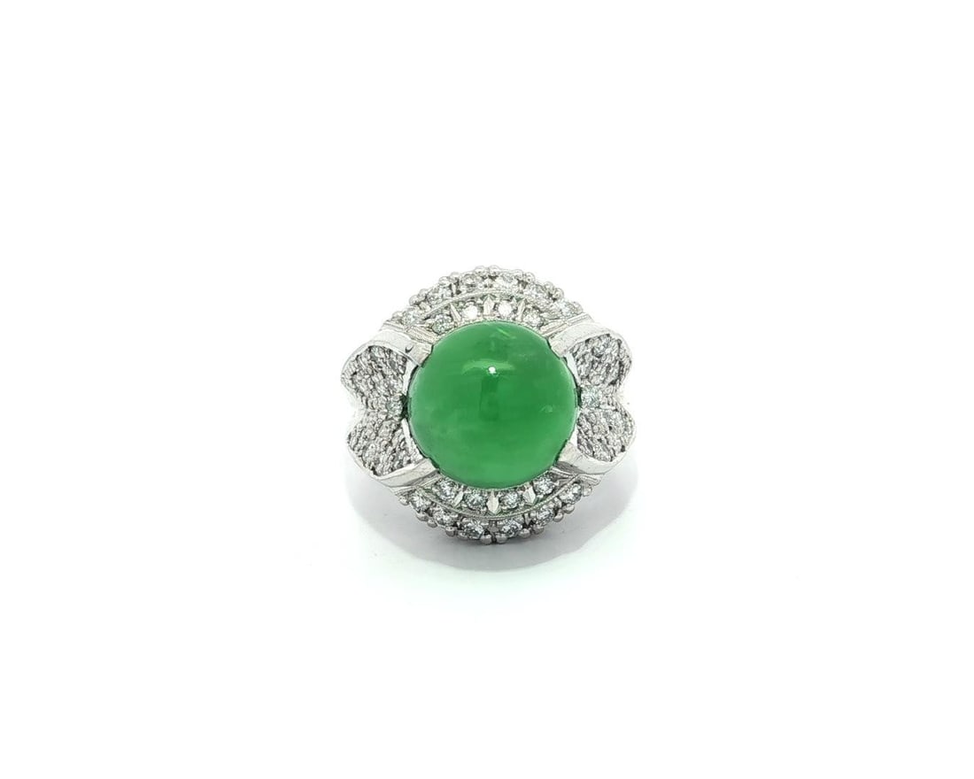 Platinum GIA Certified Burma A Jade Diamond Statement Ring: Platinum GIA Certified Burma A Jade Diamond Statement Ring This exquisite high-profile statement ring features a stunning natural A jade cabochon sourced from Burma. The jade is beautifully prong set