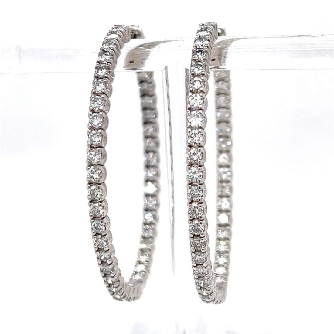 14K White Gold 4.80 Ct Diamond Hoop Earrings 76 Stones G-H VS1-SI1: 14K White Gold 4.80 Ct Diamond Hoop Earrings 76 Stones G-H VS1-SI1 Elevate your elegance with these stunning 14K White Gold Hoop Earrings, featuring a total of 76 exquisite diamonds that weigh approxi