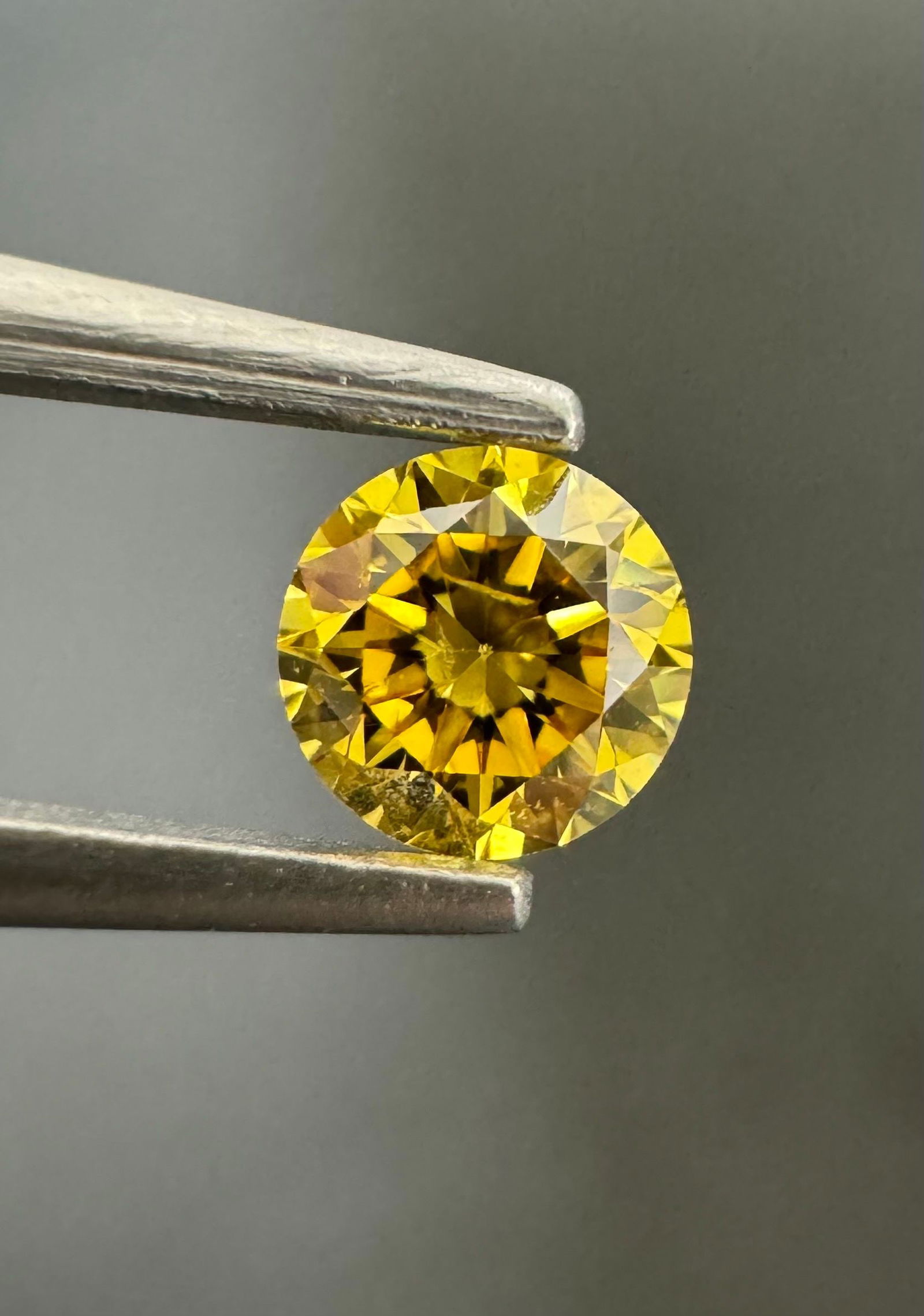 Loose Diamond - ROUND 0.34ct Fancy Vivid Orangey Yellow I1: Loose Diamond - ROUND 0.34ct Fancy Vivid Orangey Yellow I1 Source: Natural Shape: ROUND Carats: 0.34 Color: Fancy Vivid Orangey Yellow Certification: GIA Video: