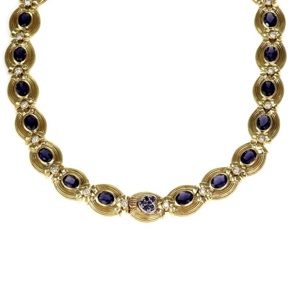 18k Yellow Gold Estate Necklace with Iolite and Diamond Accents: 18k Yellow Gold Estate Necklace with Iolite and Diamond Accents This stunning Estate collar necklace is elegantly crafted from 18k yellow gold, featuring 23 oval frame links adorned with vibrant oval