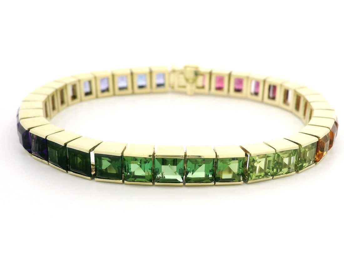 14k Yellow Gold Multicolor Gemstone Line Bracelet with Square Cut Stones: 14k Yellow Gold Multicolor Gemstone Line Bracelet with Square Cut Stones This exquisite 14k Gold Vivid Genuine Gradient Multicolor Square Step Gemstone Line Bracelet showcases a stunning array of natu
