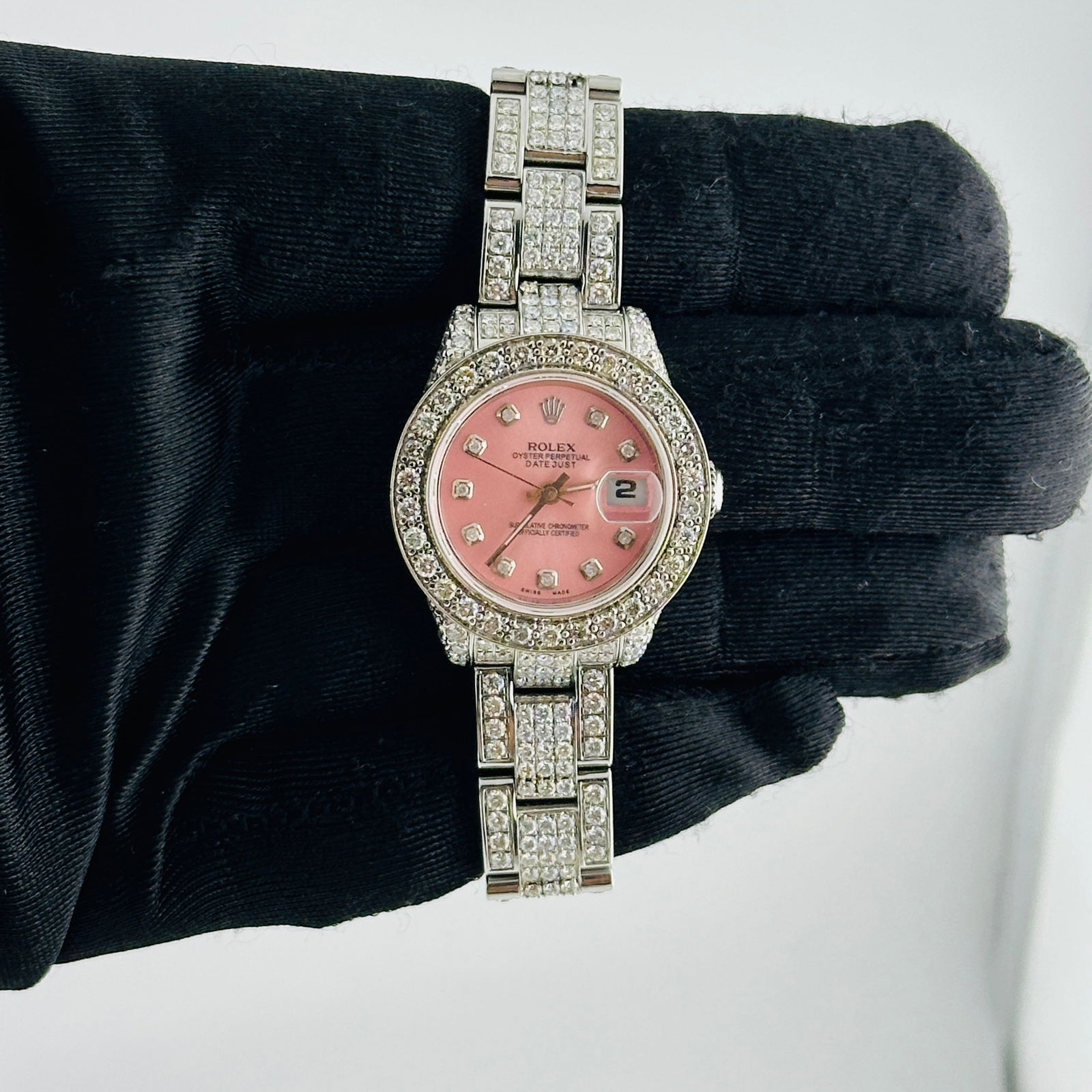 Ladies Datejust Ref 179174 Oyster Bracelet Rolex Aftermarket Pink Diamond Dial: Ladies Datejust Ref 179174 Oyster Bracelet Rolex Aftermarket Pink Diamond Dial This Rolex Datejust features a pink diamond aftermarket dial and a pave bezel, designed for ladies. The watch is equipped
