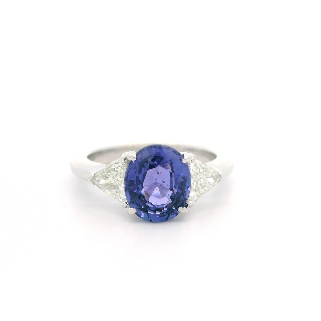 GIA Certified No Heat Purple Violet Sapphire Diamond Ring in Platinum: GIA Certified No Heat Purple Violet Sapphire Diamond Ring in Platinum This stunning cocktail ring showcases a natural, genuine oval-cut sapphire that exhibits a mesmerizing color change from purple to