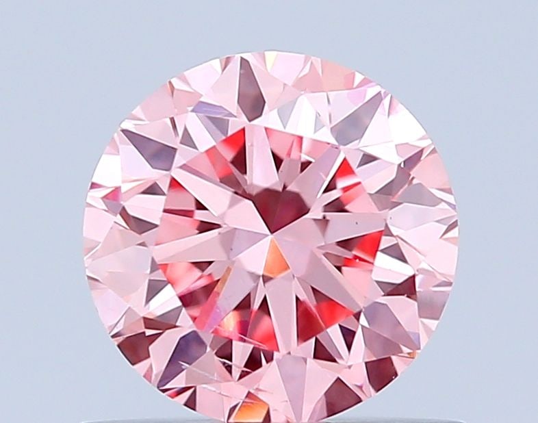 Loose Diamond - ROUND 0.73ct Fancy Intense Pink SI1: Loose Diamond - ROUND 0.73ct Fancy Intense Pink SI1 Source: This is a real non-mined Diamond that has been grown in a lab Shape: ROUND Carats: 0.73 Color: Fancy Intense Pink Certification: IGI Video: