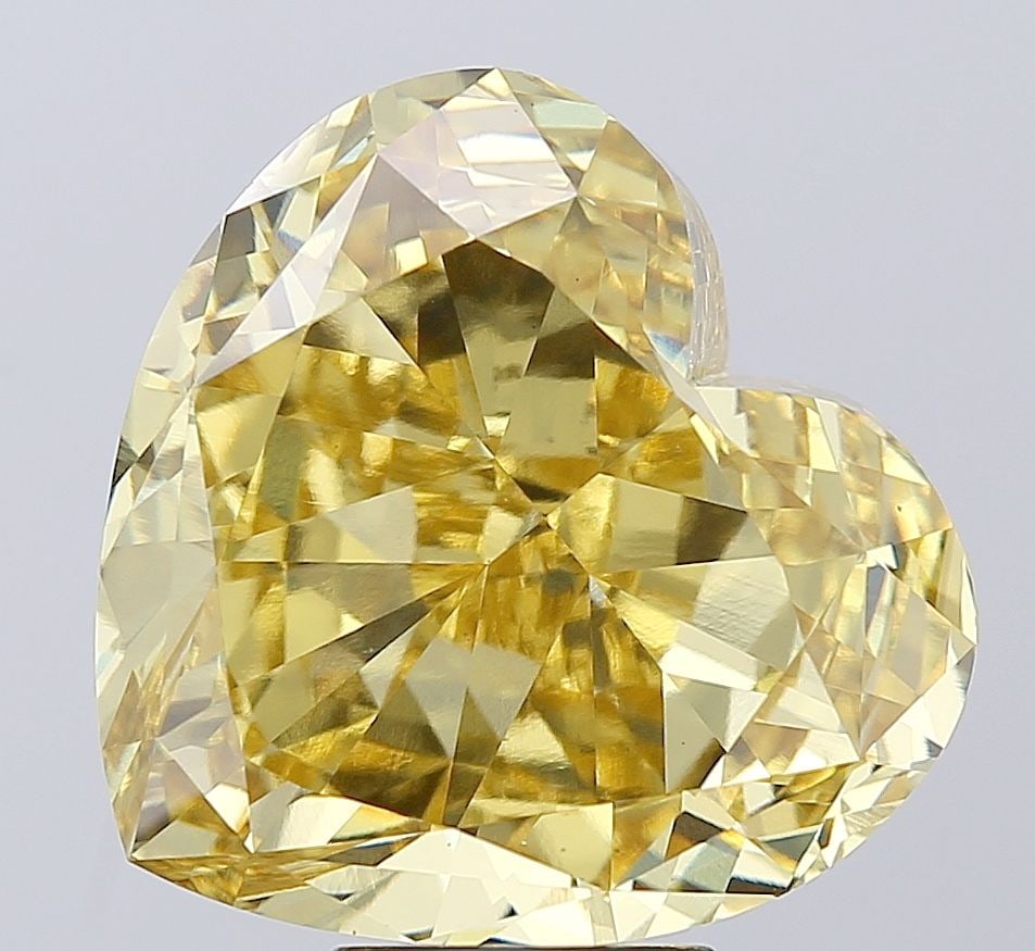 Loose Diamond - HEART 11.47ct Fancy Vivid Yellow VS1: Loose Diamond - HEART 11.47ct Fancy Vivid Yellow VS1 Source: This is a real non-mined Diamond that has been grown in a lab Shape: HEART Carats: 11.47 Color: Fancy Vivid Yellow Certification: IGI Video