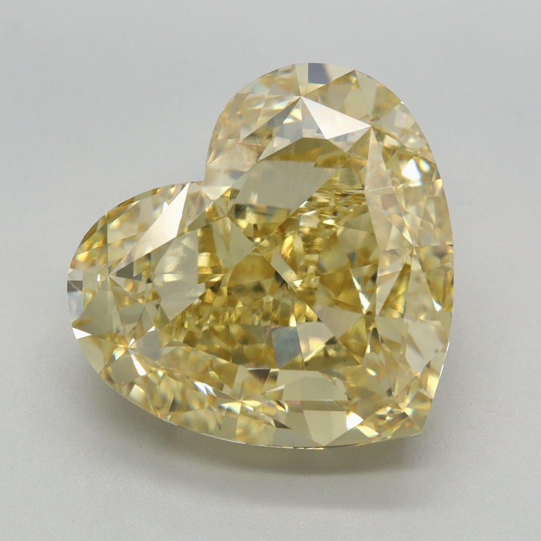 Loose Diamond - HEART 9.79ct Fancy Intense Yellow VVS2: Loose Diamond - HEART 9.79ct Fancy Intense Yellow VVS2 Source: This is a real non-mined Diamond that has been grown in a lab Shape: HEART Carats: 9.79 Color: Fancy Intense Yellow Certification: IGI Vi