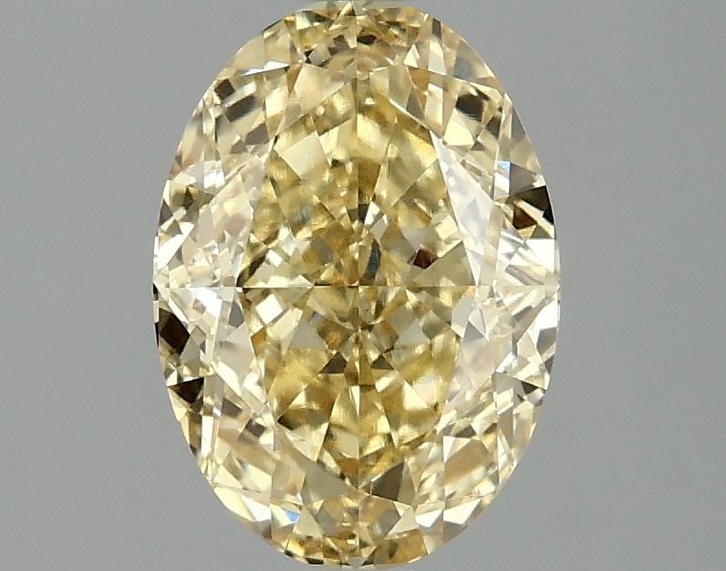 Loose Diamond - OVAL 2.1ct Fancy Vivid Yellow VS1: Loose Diamond - OVAL 2.1ct Fancy Vivid Yellow VS1 Source: This is a real non-mined Diamond that has been grown in a lab Shape: OVAL Carats: 2.1 Color: Fancy Vivid Yellow Certification: IGI Video: