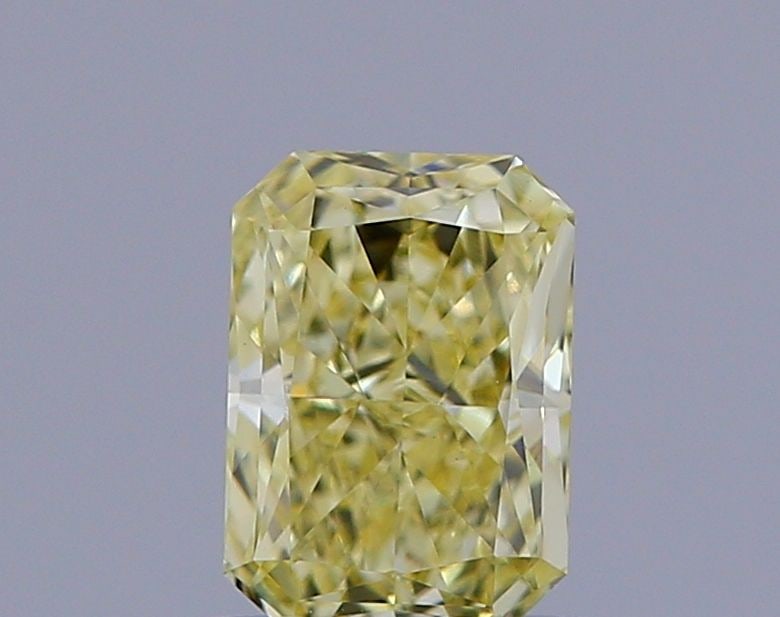 Loose Diamond - RADIANT 0.93ct Fancy Light Yellow VS1: Loose Diamond - RADIANT 0.93ct Fancy Light Yellow VS1 Source: This is a real non-mined Diamond that has been grown in a lab Shape: RADIANT Carats: 0.93 Color: Fancy Light Yellow Certification: IGI Vid