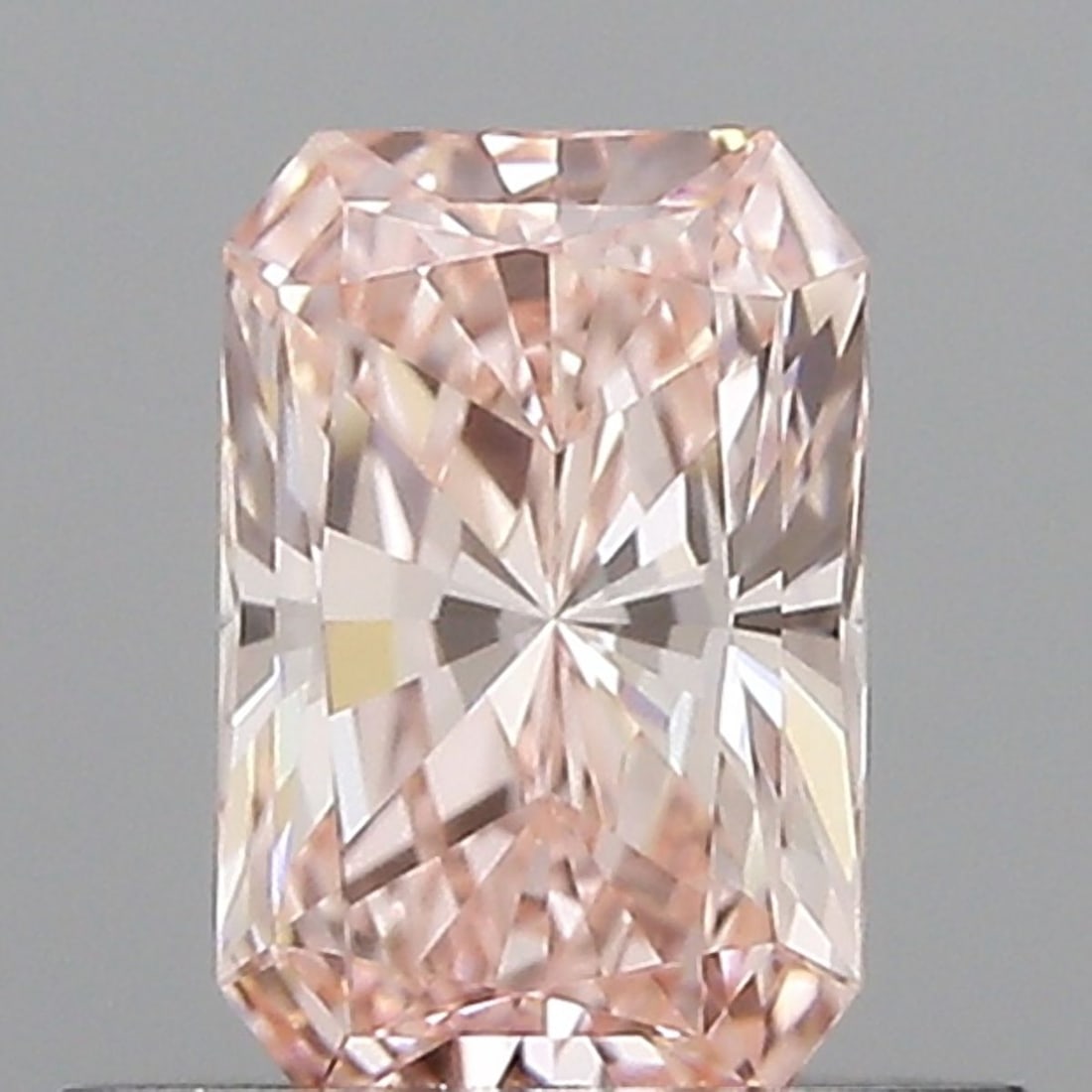 Loose Diamond - RADIANT 0.52ct Fancy Vivid Pink VVS1: Loose Diamond - RADIANT 0.52ct Fancy Vivid Pink VVS1 Source: This is a real non-mined Diamond that has been grown in a lab Shape: RADIANT Carats: 0.52 Color: Fancy Vivid Pink Certification: IGI Video: