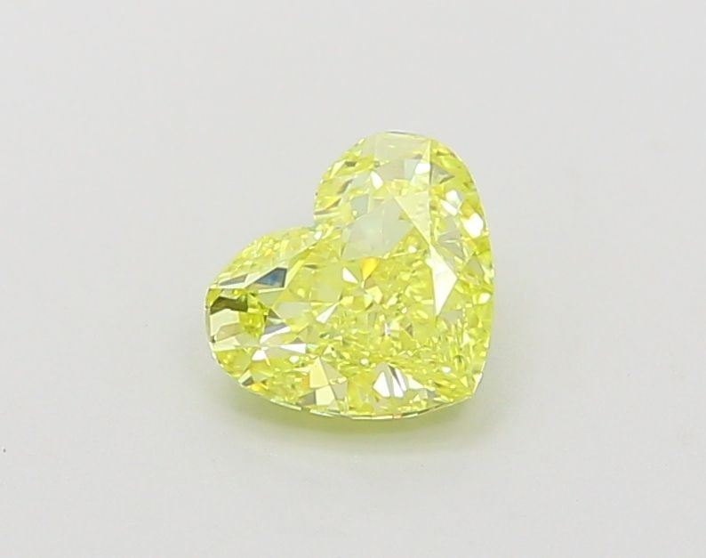Loose Diamond - HEART 0.98ct Fancy Vivid Yellow VVS1: Loose Diamond - HEART 0.98ct Fancy Vivid Yellow VVS1 Source: This is a real non-mined Diamond that has been grown in a lab Shape: HEART Carats: 0.98 Color: Fancy Vivid Yellow Certification: IGI Video: