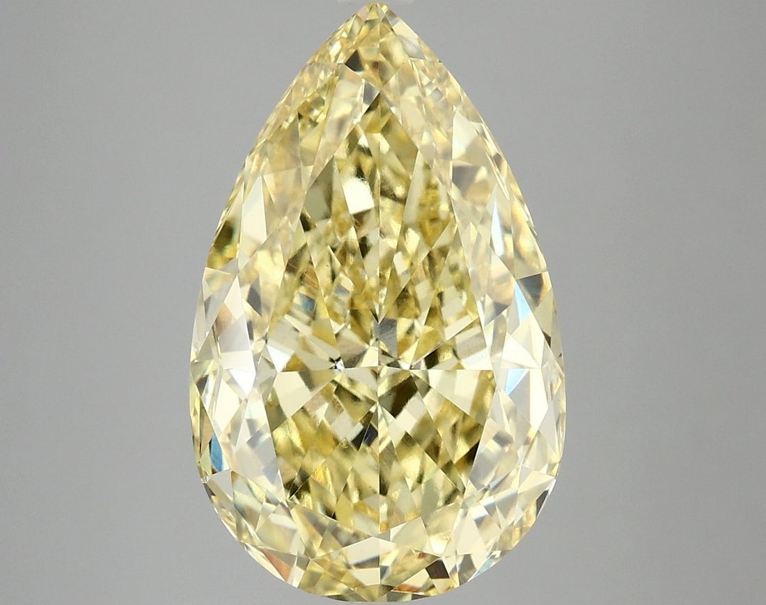 Loose Diamond - PEAR 7.09ct Fancy Vivid Yellow VS1: Loose Diamond - PEAR 7.09ct Fancy Vivid Yellow VS1 Source: This is a real non-mined Diamond that has been grown in a lab Shape: PEAR Carats: 7.09 Color: Fancy Vivid Yellow Certification: IGI Video: