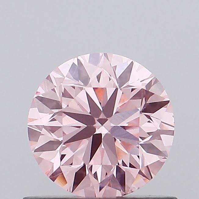 Loose Diamond - ROUND 0.7ct Fancy Vivid Pink VS1: Loose Diamond - ROUND 0.7ct Fancy Vivid Pink VS1 Source: This is a real non-mined Diamond that has been grown in a lab Shape: ROUND Carats: 0.7 Color: Fancy Vivid Pink Certification: IGI Video: